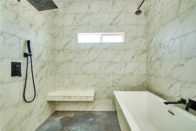 a bathroom with a white bath tub
