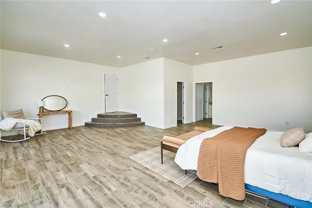 a bedroom with a bed and a closet