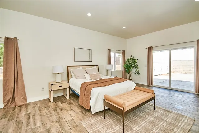 a bedroom with a large bed and a window