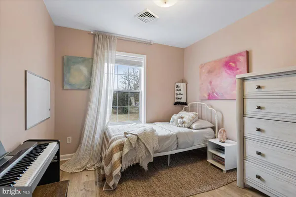 a bedroom with a bed and closet
