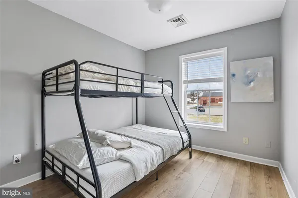 a bedroom with a bed and a walk in closet