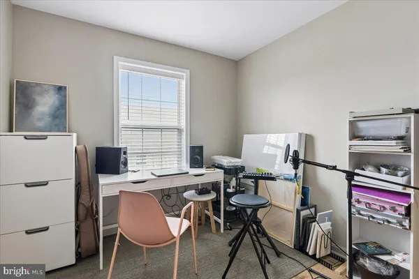 a workspace with furniture and a window