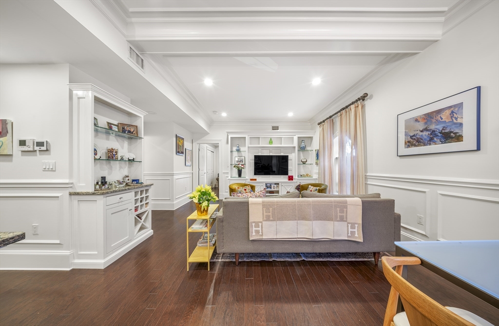 616 East 4th Street, Unit 301 Boston, MA 02127 - Photo 4 of 13 a living room with stainless steel appliances furniture and a wooden floor
