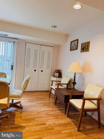 a bedroom with bed and a flat screen tv