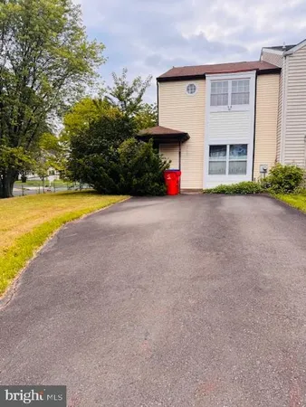 a view of a house with a yard and garage
