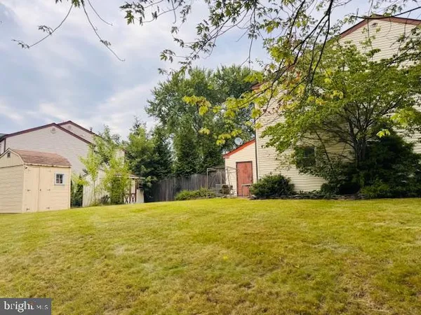 an aerial view of a house with yard swimming pool and outdoor seating