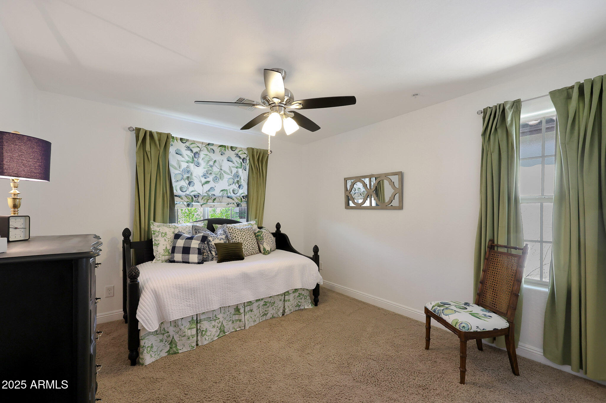 20563 West White Rock Road Buckeye, AZ 85396 - Photo 15 of 44 a bedroom with a bed and a chandelier