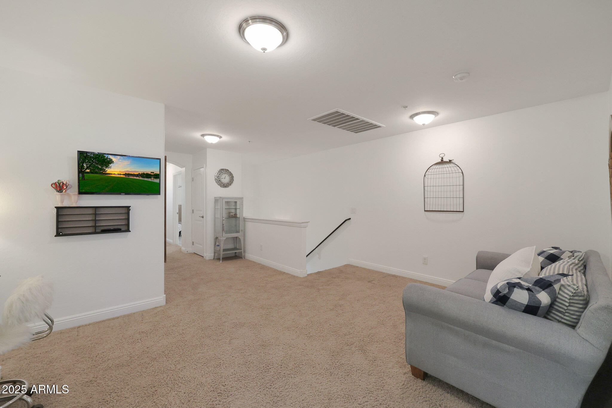 20563 West White Rock Road Buckeye, AZ 85396 - Photo 20 of 44 a living room with furniture and a flat screen tv