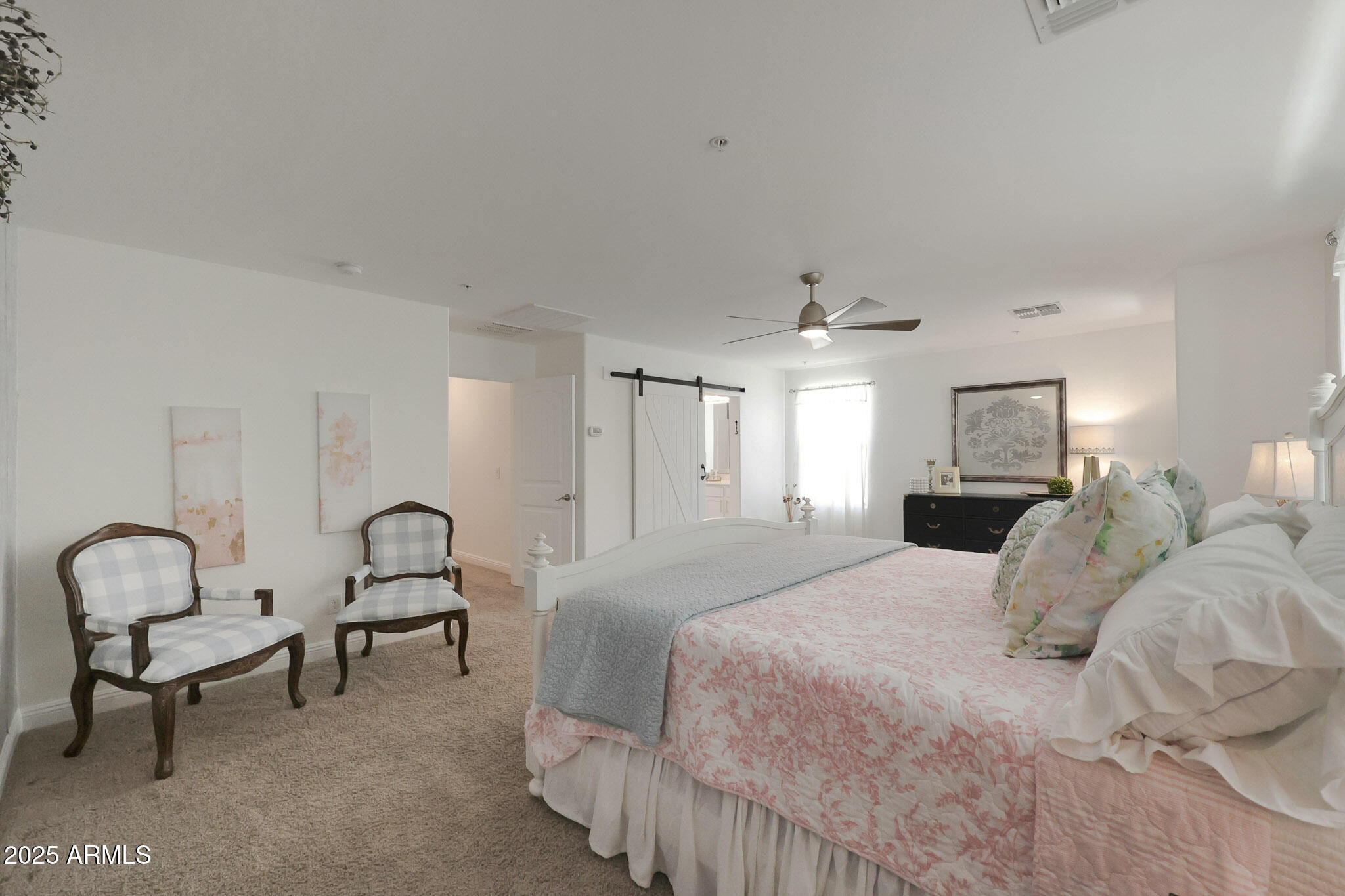 20563 West White Rock Road Buckeye, AZ 85396 - Photo 24 of 44 a bedroom with bed and a window