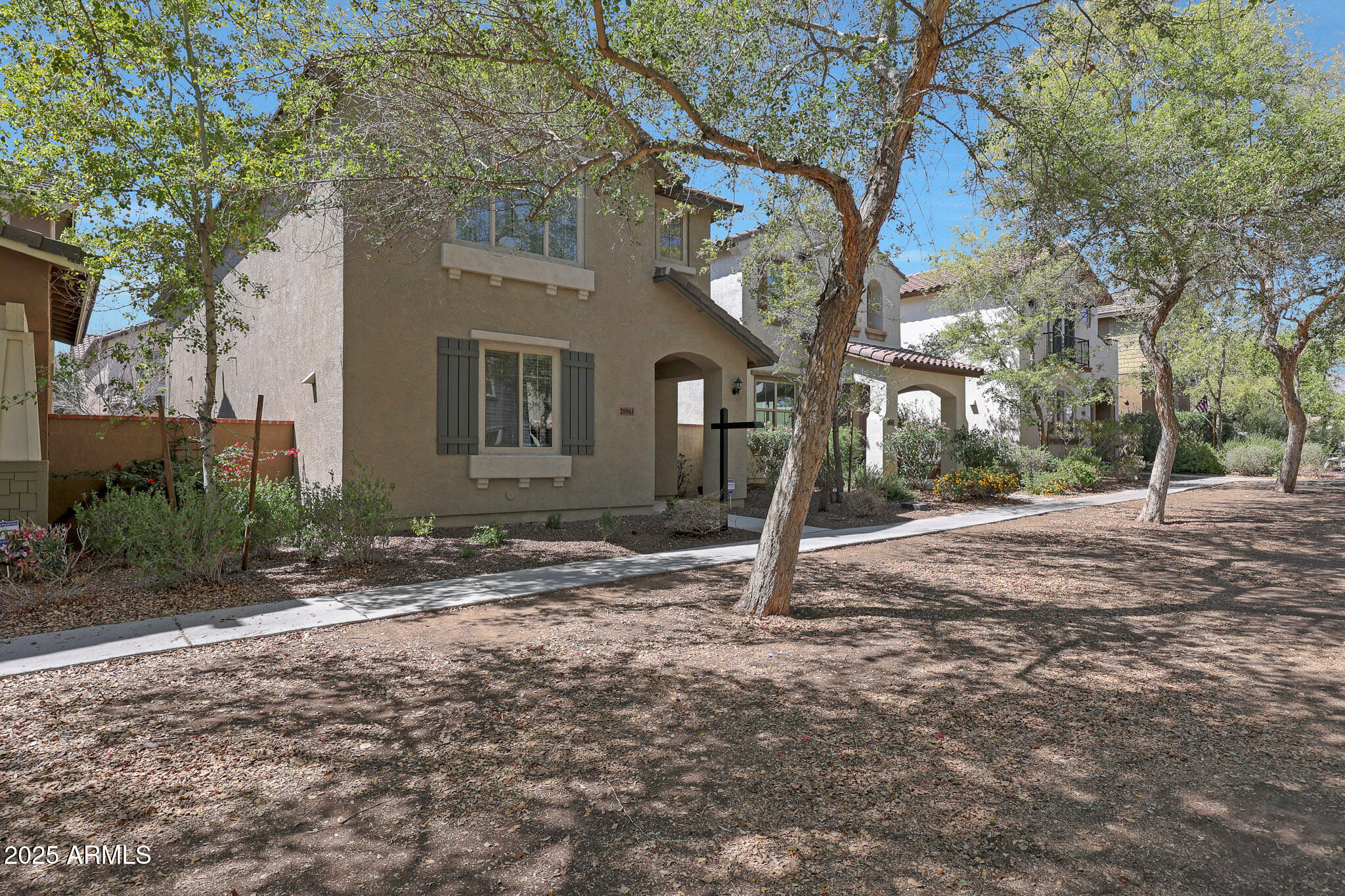 20563 West White Rock Road Buckeye, AZ 85396 - Photo 3 of 44 a backyard of a house with lots of trees