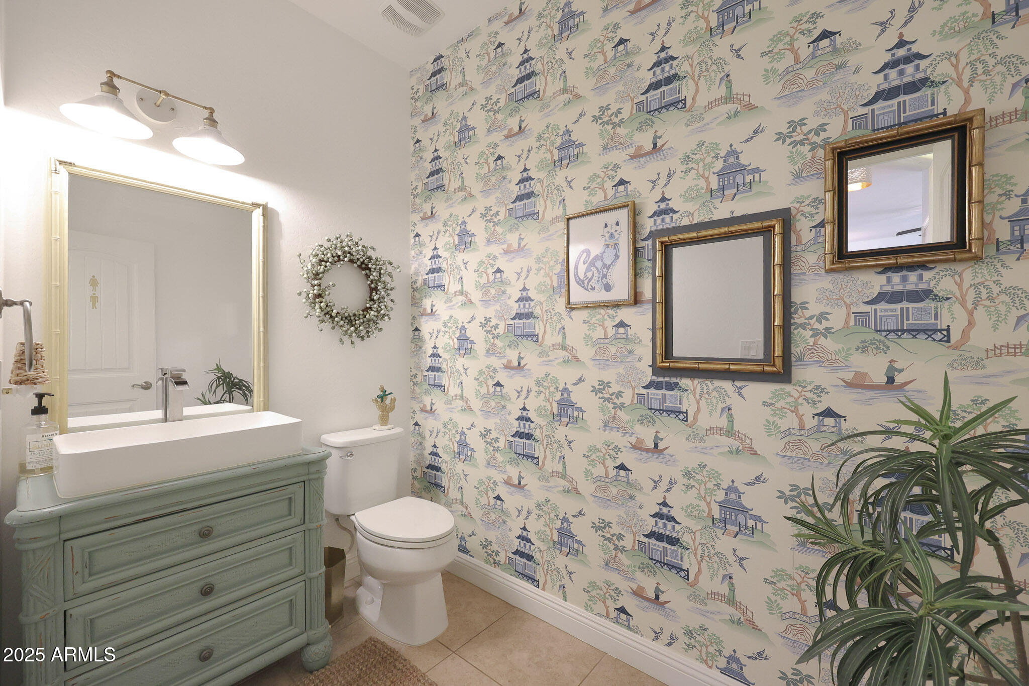 20563 West White Rock Road Buckeye, AZ 85396 - Photo 31 of 44 a bathroom with a toilet sink and mirror