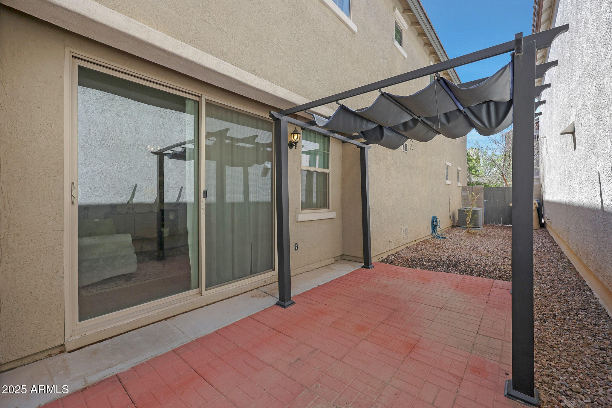 20563 West White Rock Road Buckeye, AZ 85396 - Photo 32 of 44 a view of a hallway with a glass door and shower