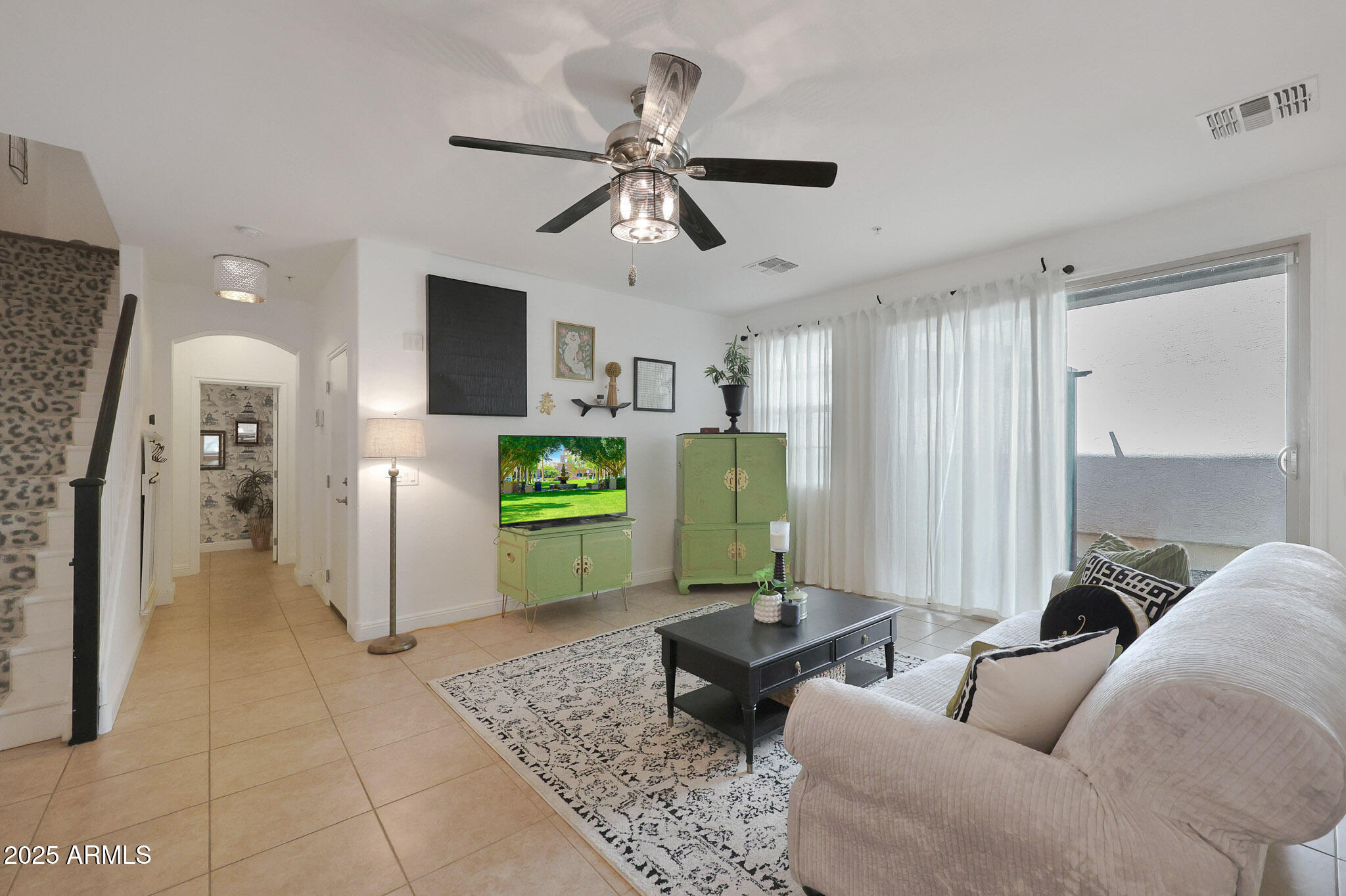 20563 West White Rock Road Buckeye, AZ 85396 - Photo 4 of 44 a living room with furniture and a window