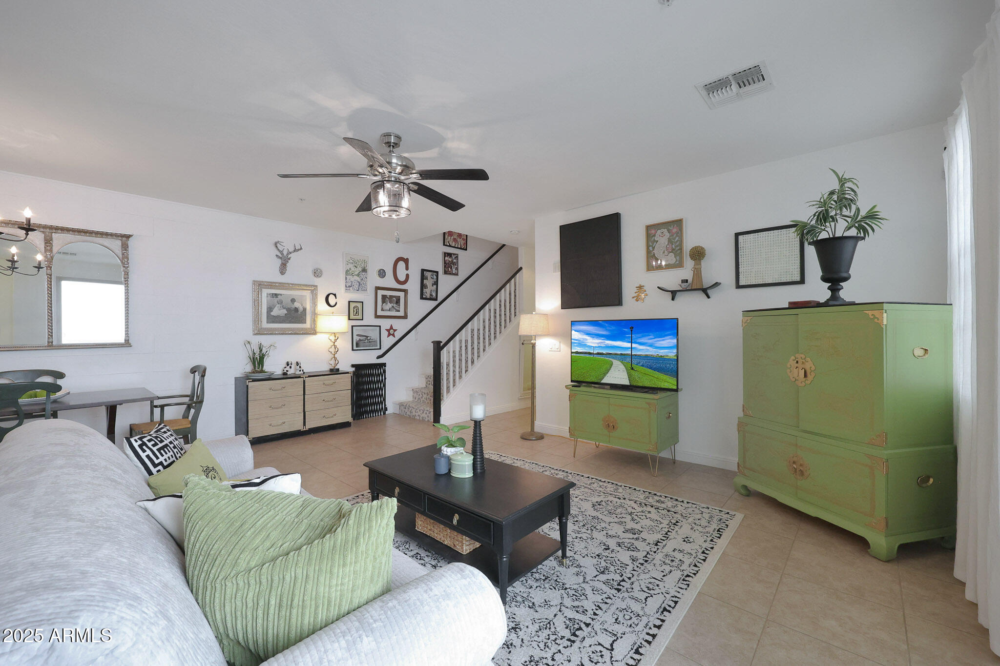 20563 West White Rock Road Buckeye, AZ 85396 - Photo 5 of 44 a living room with furniture and a chandelier