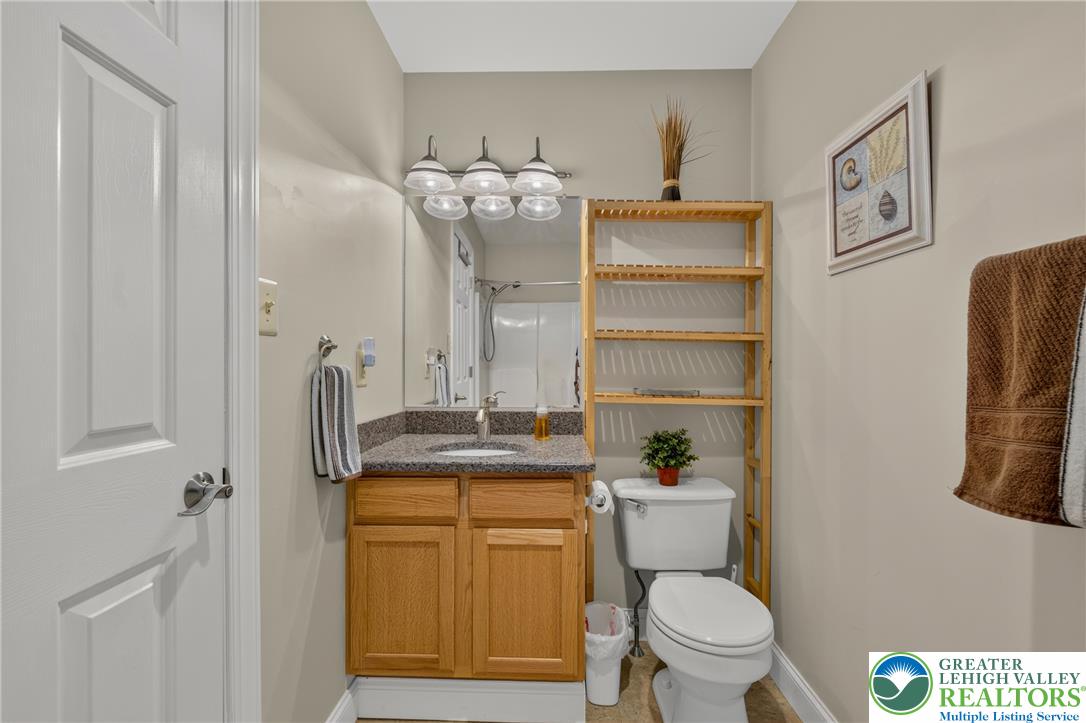 1702 Red Bud Road Quakertown, PA 18951 - Photo 48 of 68 A well-appointed bathroom features a practical vanity with a granite counter and ample storage solutions.