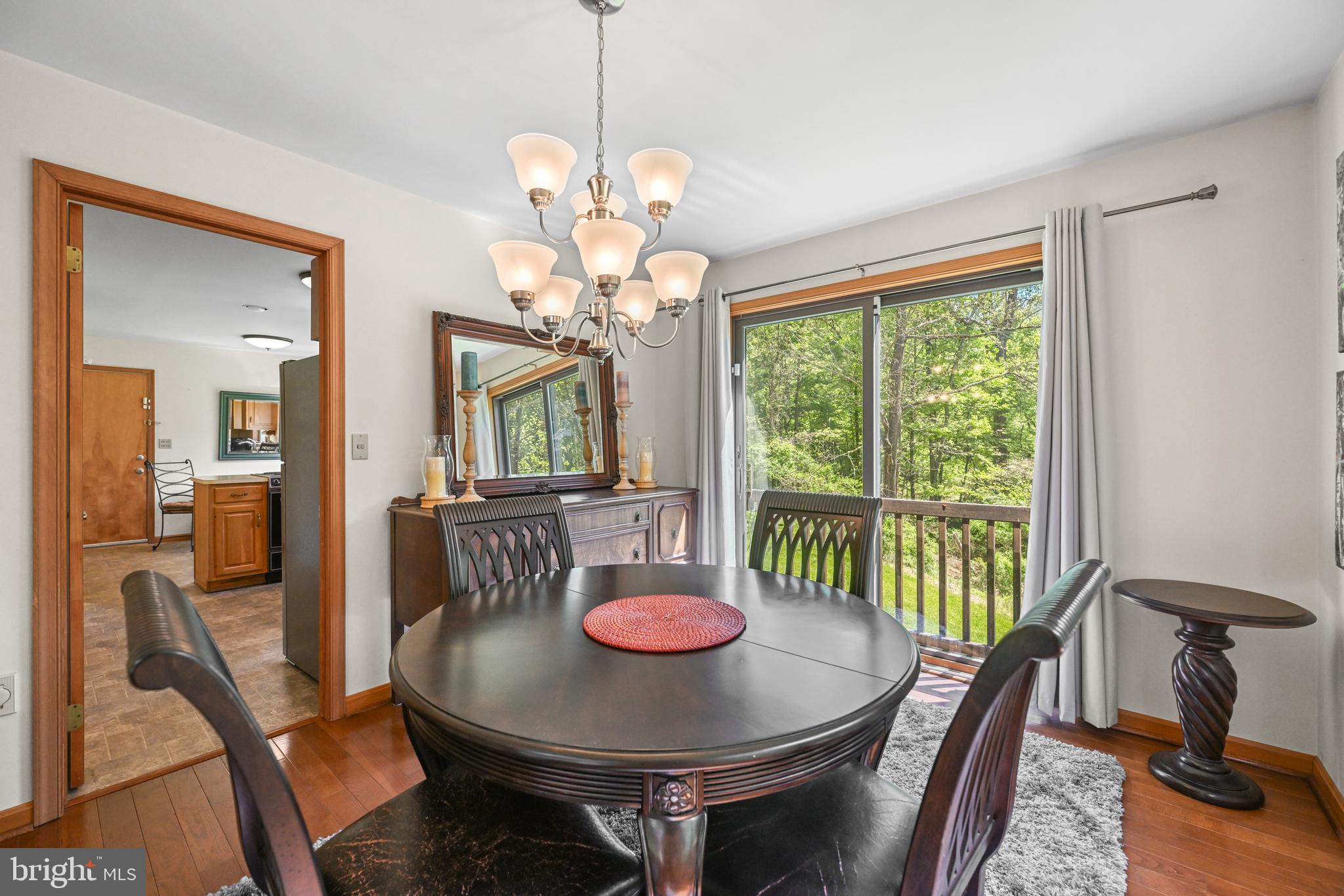 1680 East Street Road Kennett Square, PA 19348 - Photo 9 of 30 a view of a dining room with furniture window and wooden floor