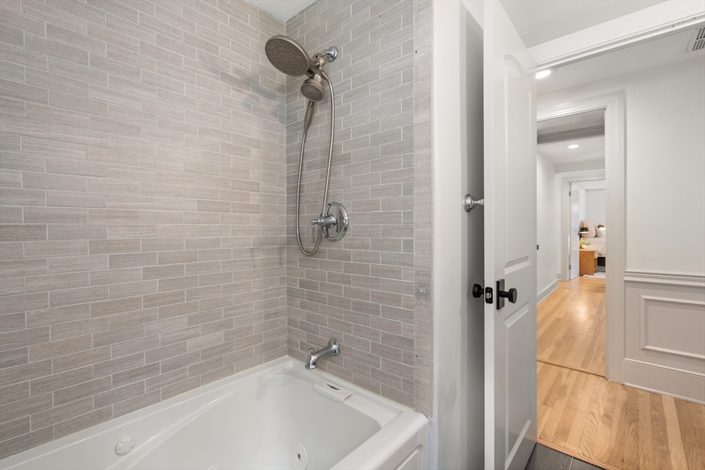 57 Marlboro Road Sudbury, MA 01776 - Photo 21 of 40 a bathroom with a tub and a shower