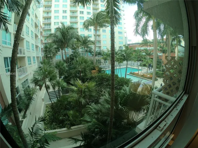 a view of a balcony with furniture