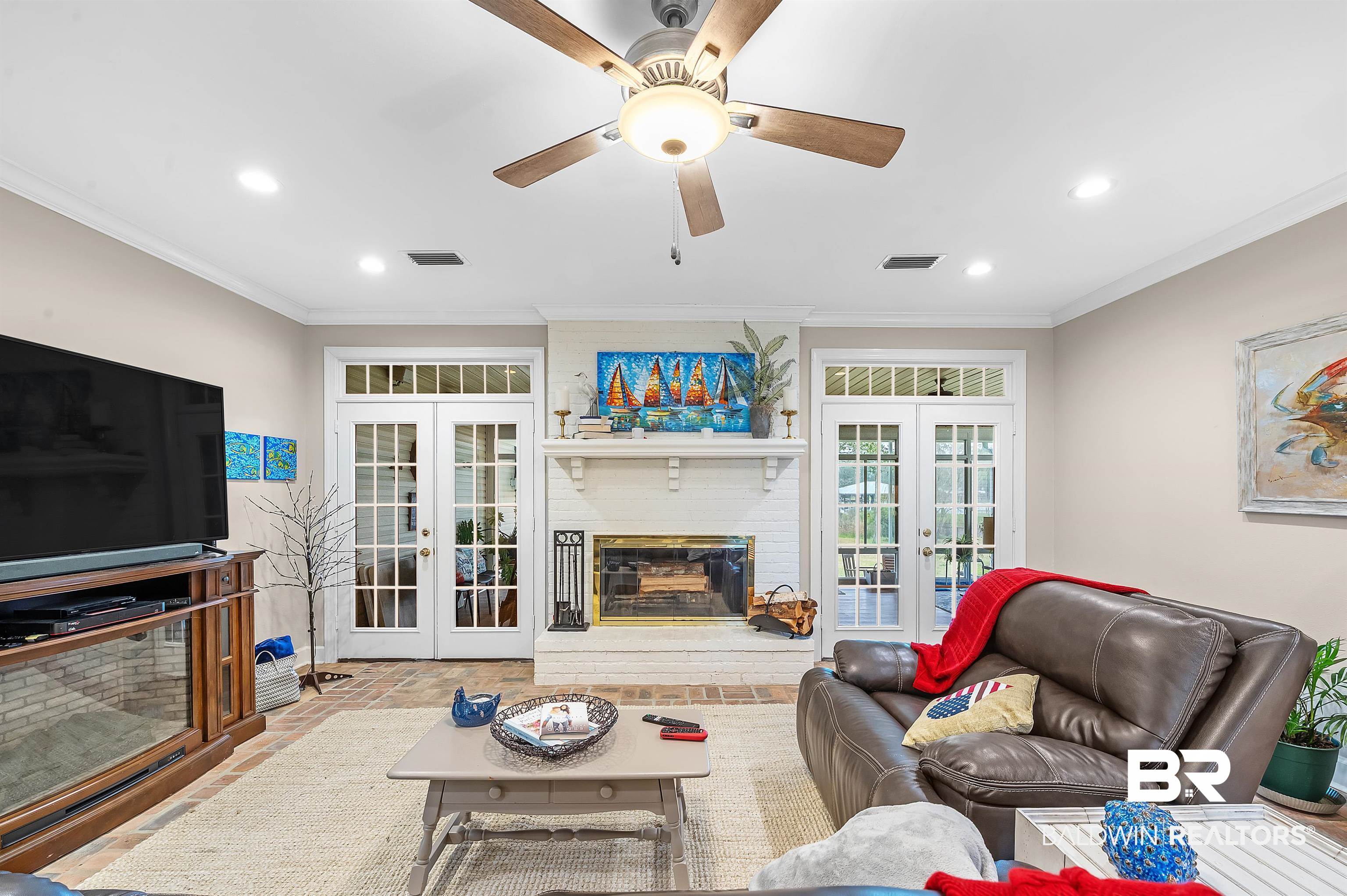8915 Bay Point Drive Elberta, AL 36530 - Photo 13 of 74 Living area with visible vents, ornamental molding, and french doors