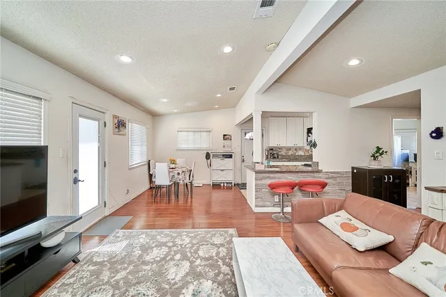 a living room with furniture and flat screen tv