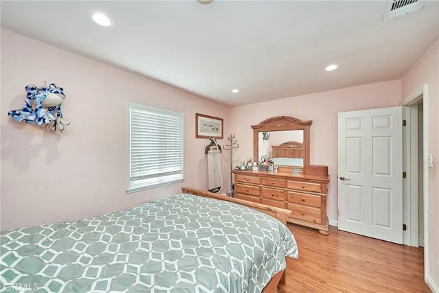 a bedroom with a bed and a dresser