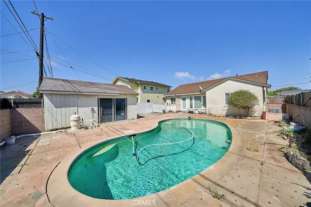 a view of a house with backyard porch and furniture