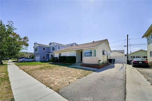 a city street lined with buildings and trees