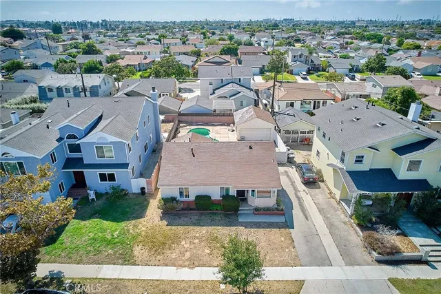 an aerial view of residential houses with outdoor space