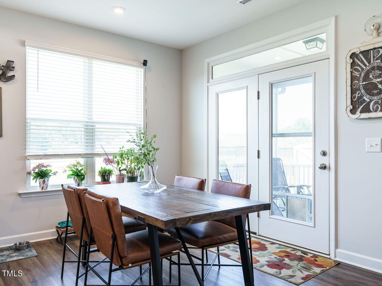 7218 Cabernet Franc Drive Willow Spring, NC 27592 - Photo 14 of 42 a dining room with furniture and wooden floor