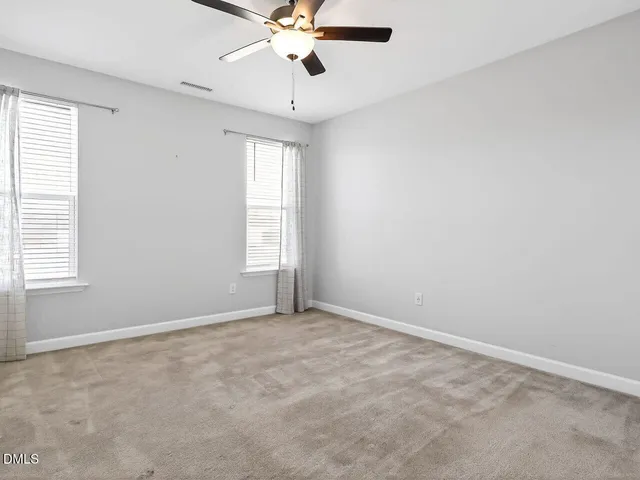 a kitchen with stainless steel appliances granite countertop a sink stove microwave and refrigerator