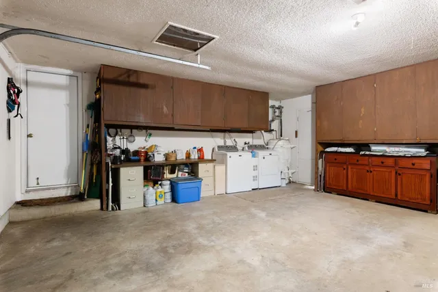 a view of a house with a yard and sitting area