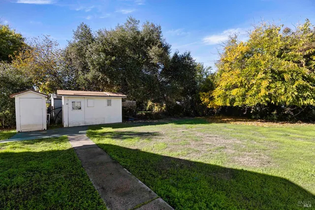 a view of a back yard of the house
