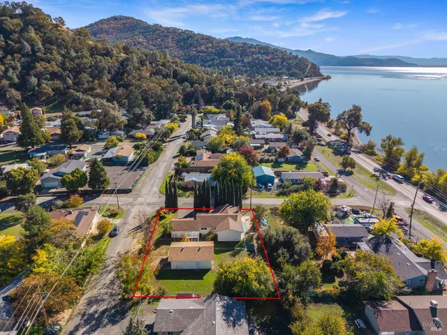 an aerial view of residential houses with outdoor space