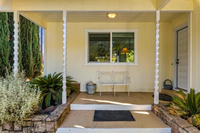 hallway with wooden floor windows and livingroom view