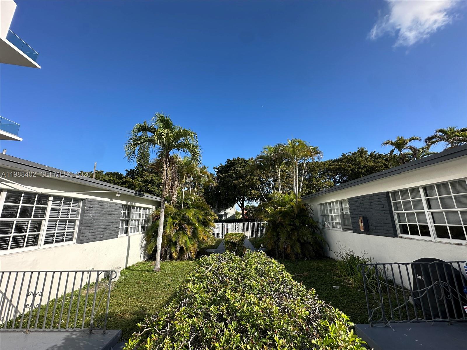 740 84th Street, Unit 3 Miami Beach, FL 33141 - Photo 3 of 12 a view of a house with a yard