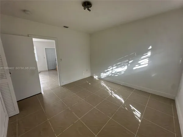 a view of an empty room and window