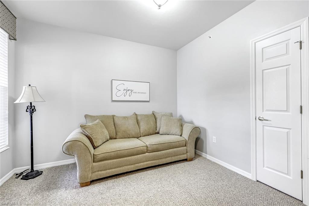 1345 Henley Street, Unit 706 Naples, FL 34105 - Photo 14 of 20 a living room with furniture and a window