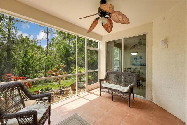 a outdoor space with the couches and dining table with the garden view