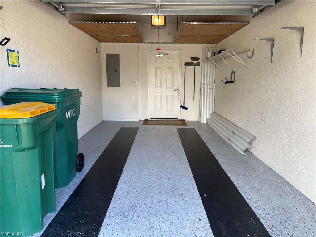 1345 Henley Street, Unit 706 Naples, FL 34105 - Photo 19 of 20 a view of a hallway with wooden floor and staircase