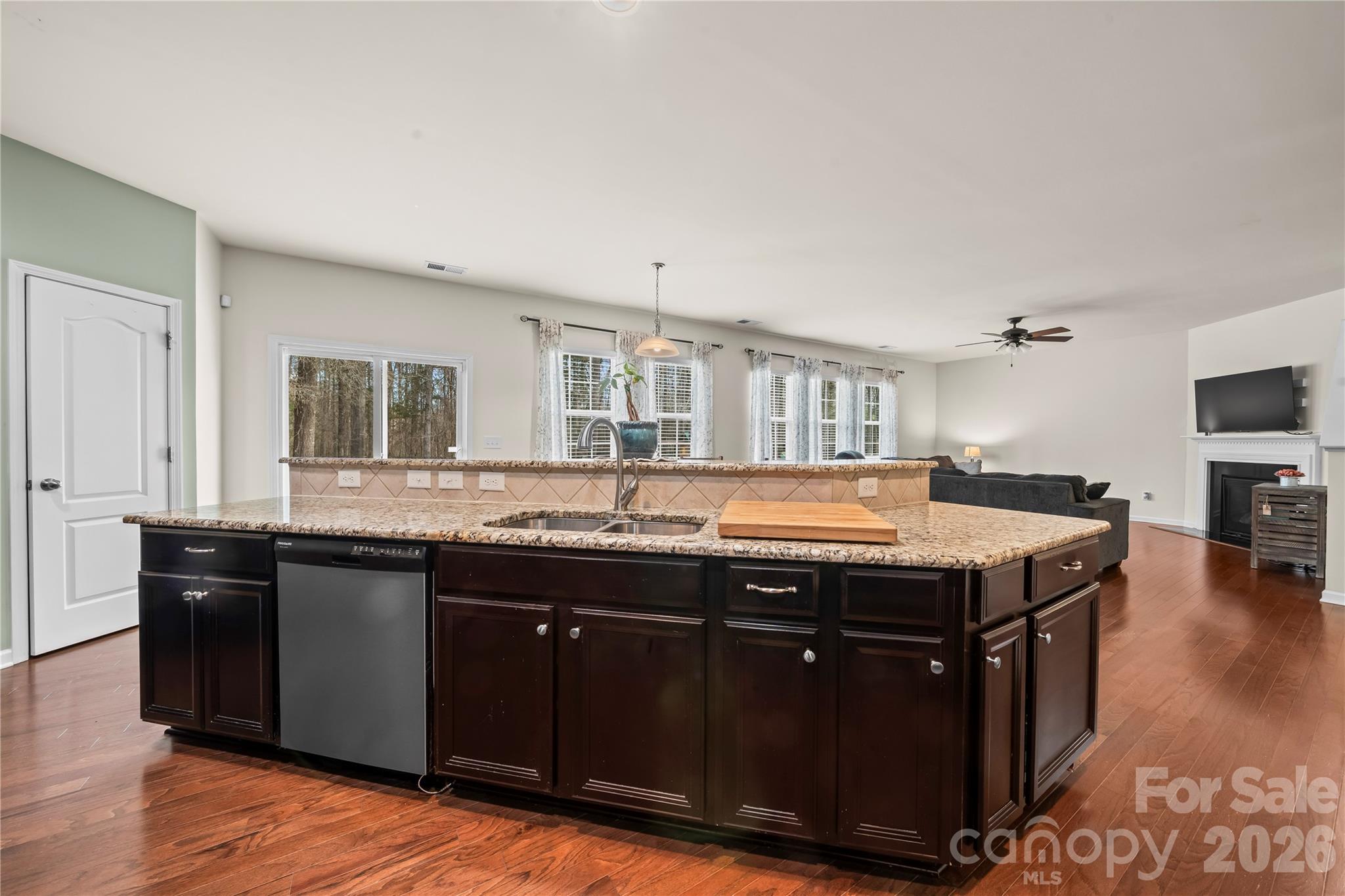 10666 Sapphire Trail Davidson, NC 28036 - Photo 11 of 34 a kitchen with a stove a sink and a refrigerator
