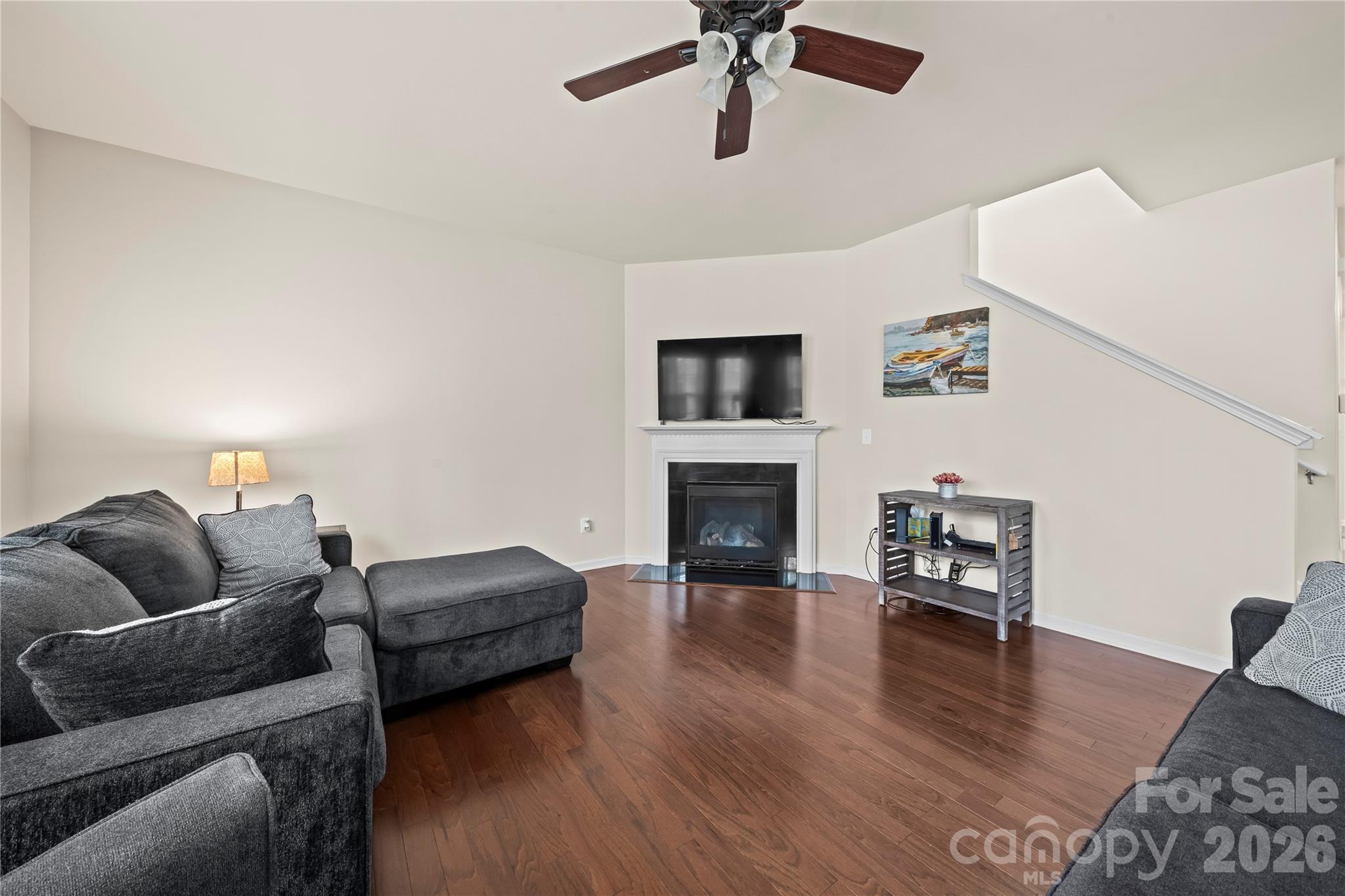 10666 Sapphire Trail Davidson, NC 28036 - Photo 15 of 34 a living room with furniture and a fireplace