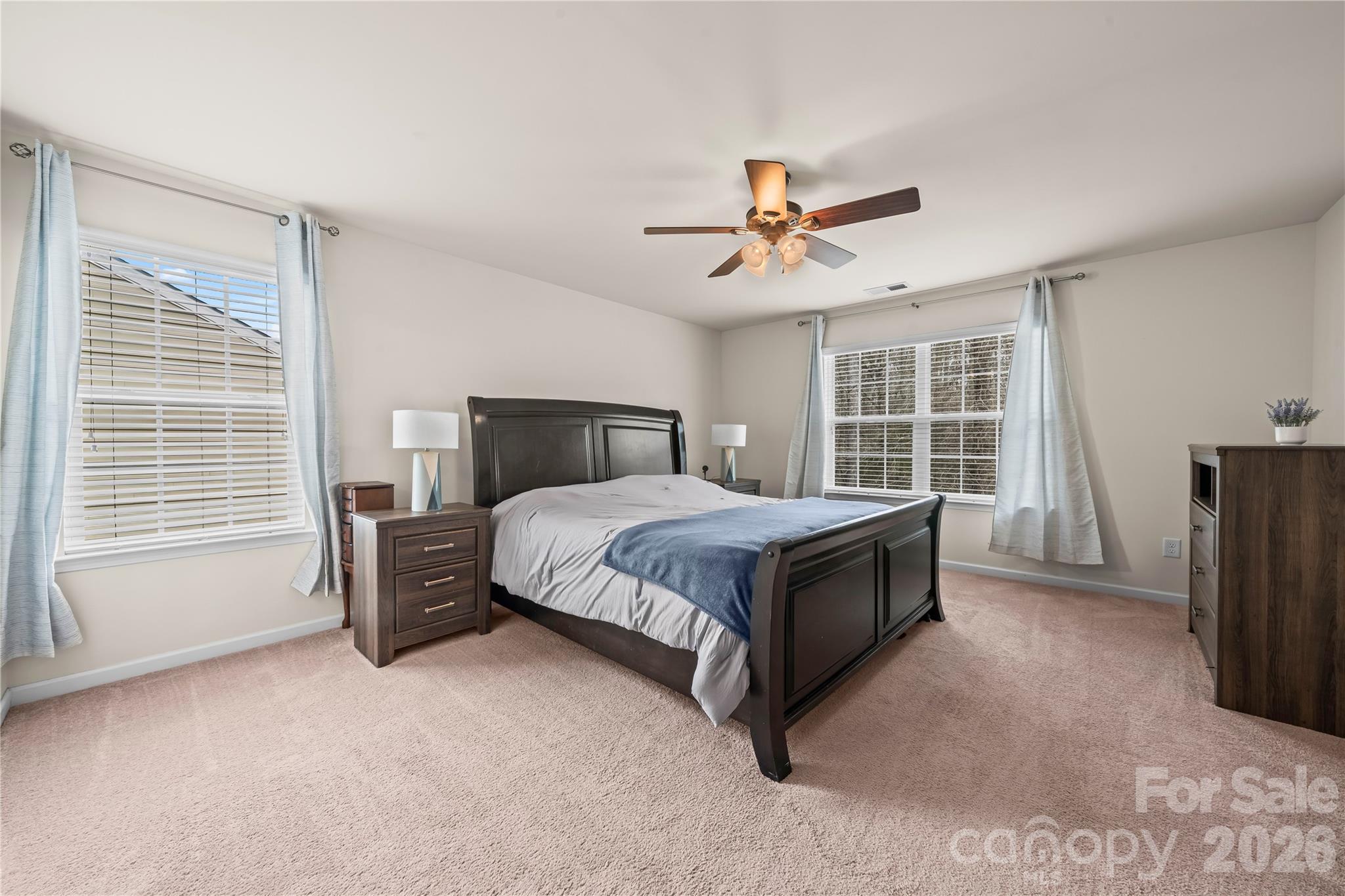 10666 Sapphire Trail Davidson, NC 28036 - Photo 18 of 34 a bedroom with a bed closet and a window