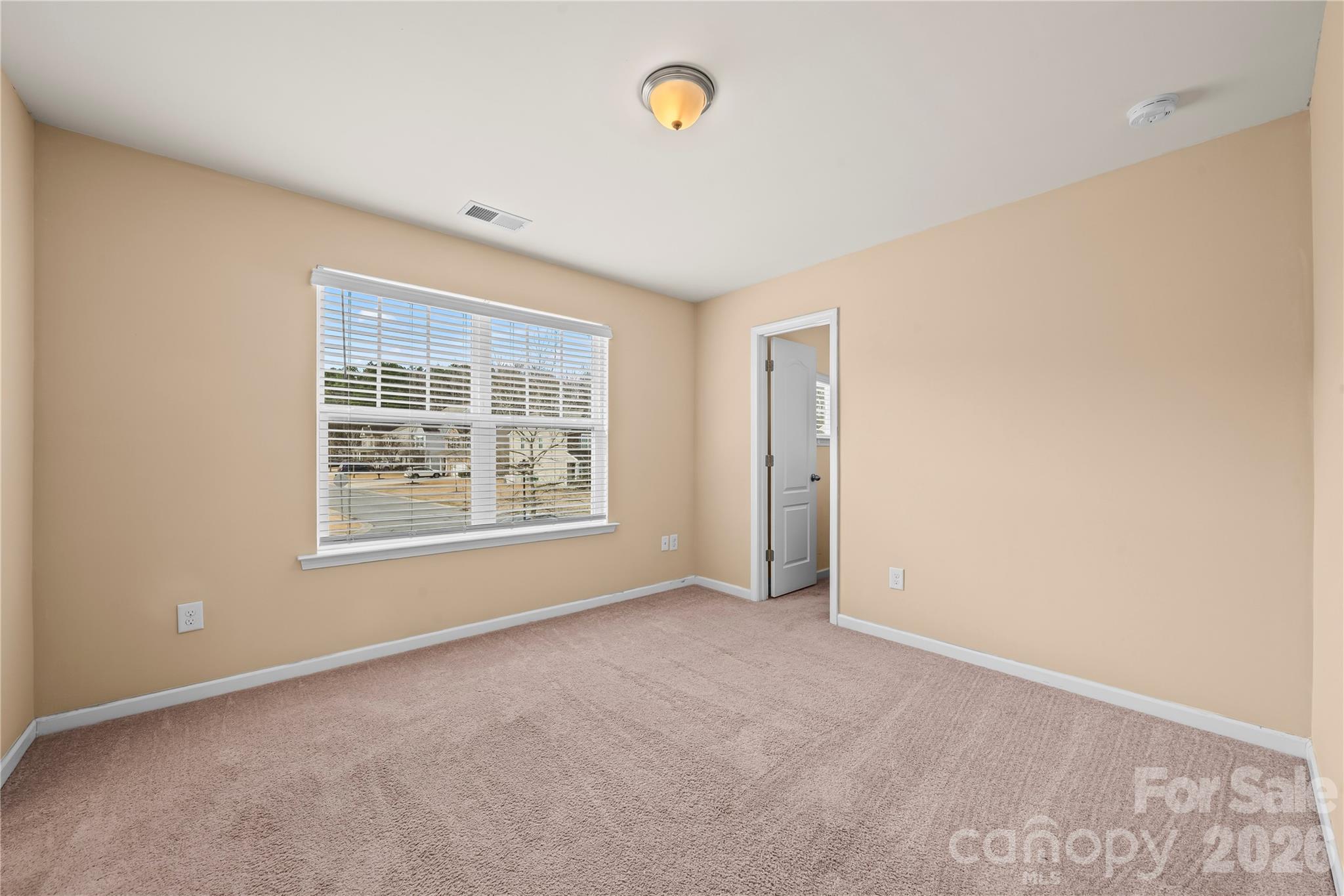 10666 Sapphire Trail Davidson, NC 28036 - Photo 24 of 34 a view of an empty room with a window
