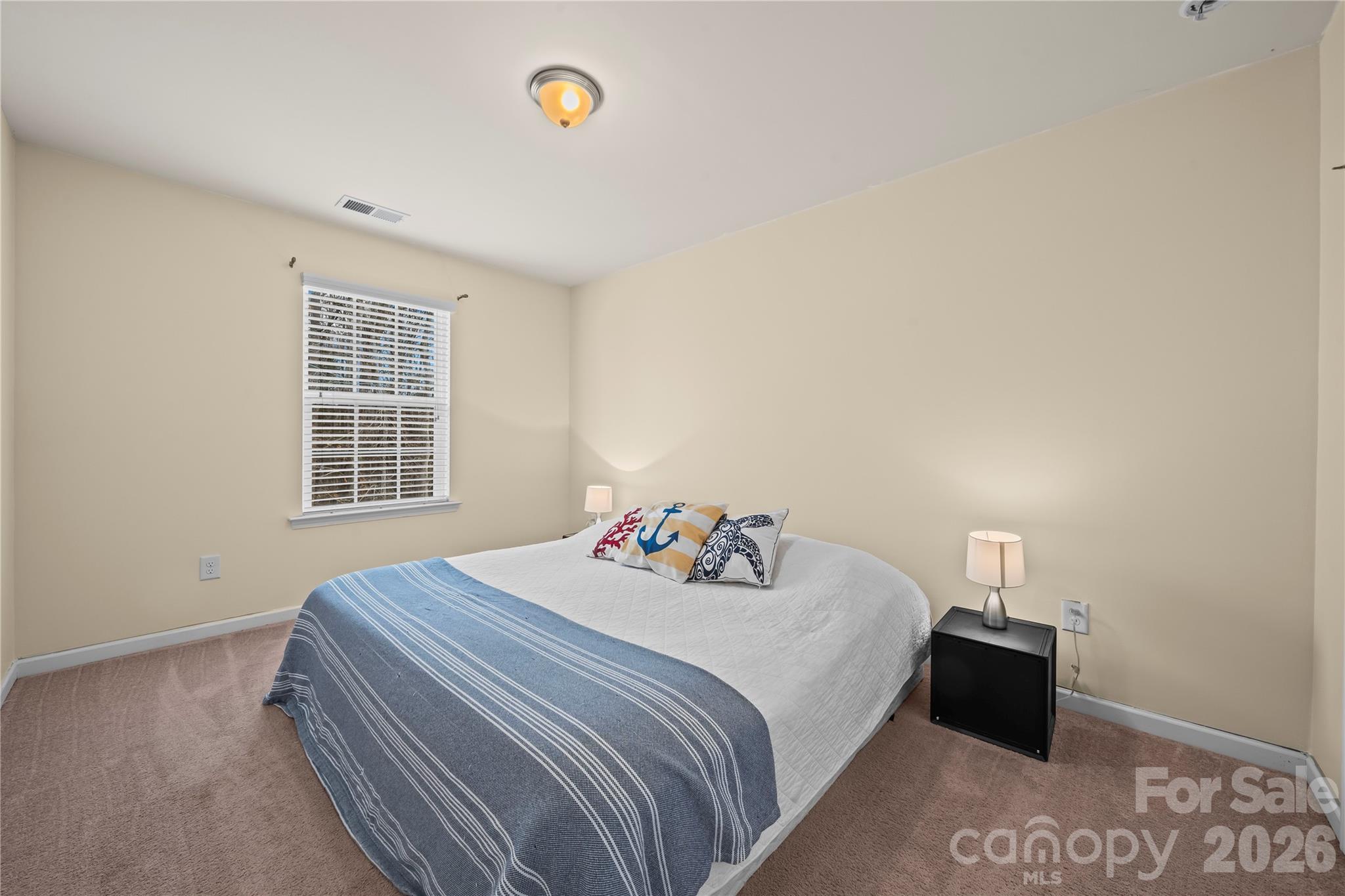 10666 Sapphire Trail Davidson, NC 28036 - Photo 27 of 34 a bedroom with a bed and a window