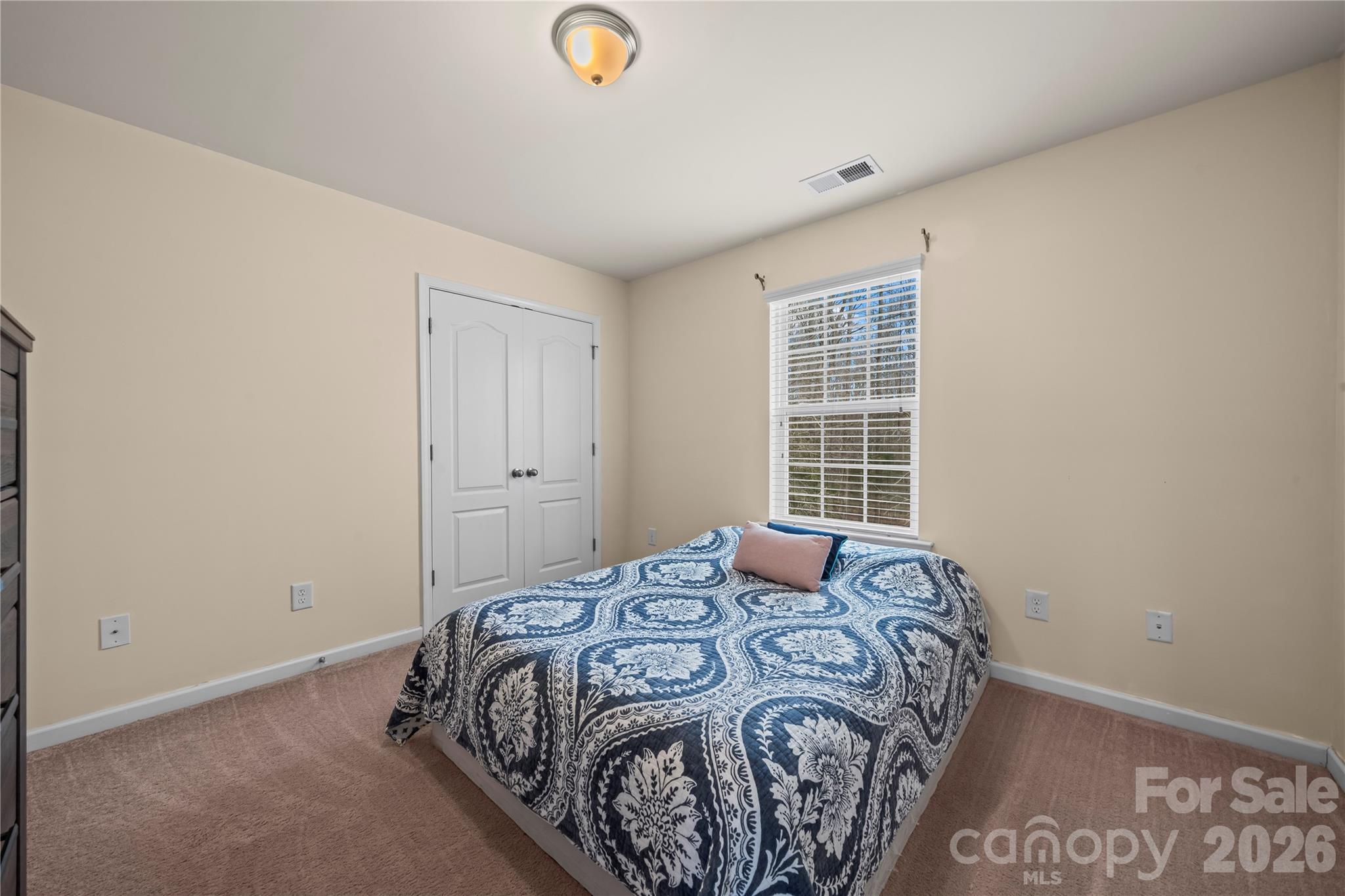 10666 Sapphire Trail Davidson, NC 28036 - Photo 28 of 34 a bedroom with a bed and a window