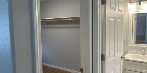 a bathroom with a glass shower door