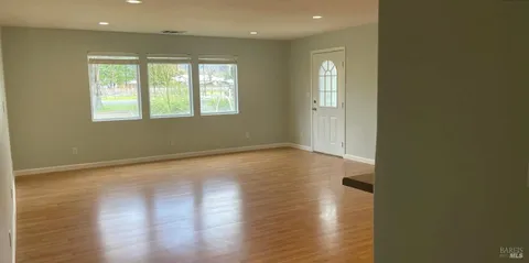 a view of a kitchen with a sink and a window