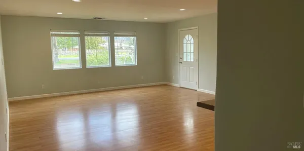 a view of a kitchen with a sink and a window
