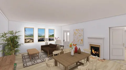 a living room with furniture a window and a fireplace