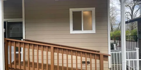 a view of porch with a small yard